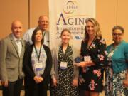 Northeast Hazel Dell: The Area Agency on Aging & Disabilities of Southwest Washington’s Primary Care Liaison program earned an Aging Innovations Award from the National Association of Area Agencies on Aging. From left: Danny Maxson with WellCare Health Plans, Dave Kelly, executive director of the area agency, Katherine Bennett, geriatric medicine training lead with the Northwest Geriatric Workforce Enhancement Center, Allison Boll, primary care liaison with the Aging and Disability Services Seattle King County, Melissa Ensey with aging and disability services, Kathryn Boles, National Association of Area Agencies on Aging president and CEO.