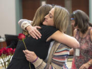 Victim Advocate Amy Harlan, left, and Brenda Eyman, whose sister, Janell Knight, was killed in 2016, embrace during a service honoring the National Day of Remembrance on Friday at the Clark County Public Service Center.