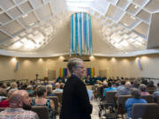 Vancouver United Church of Christ Pastor Jennifer Brownell starts proceedings during a rededication ceremony for the church Sunday, after it suffered heavy damage from an arson fire in May 2016.