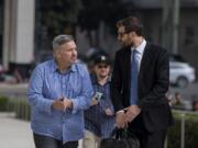 Former Vancouver pastor John Bishop, left, arrives to be sentenced for unlawful importation of a controlled substance-marijuana at the James M. Carter and Judith N. Keep United States Courthouse in San Diego, Calif., on Friday morning, Sept. 21, 2018.