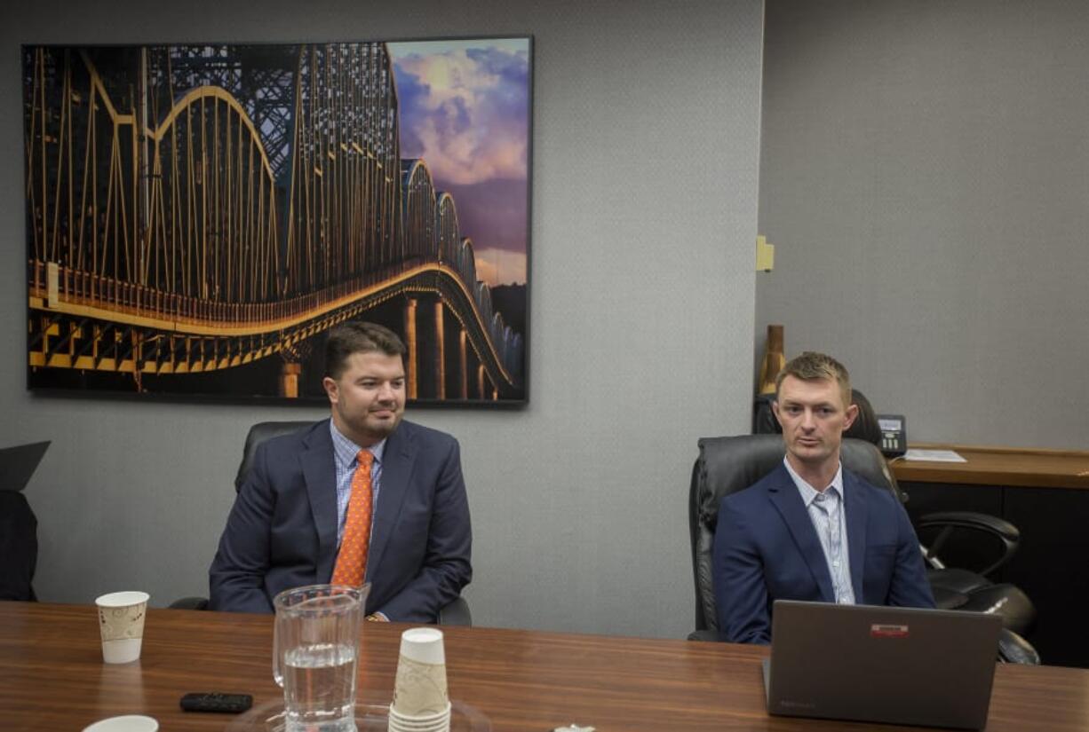 State Rep. Brandon Vick, R-Felida, left, and Democratic challenger Chris Thobaben speak with members of The Columbian’s Editorial Board on Tuesday.