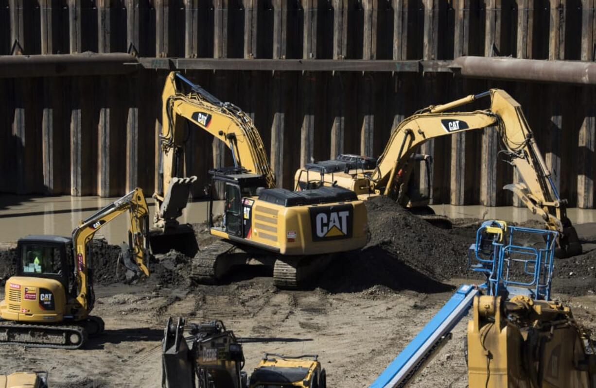 Water from the Columbia River has started to become visible at river level at the bottom of the Hotel Indigo construction site on Block 4 of The Waterfront Vancouver.