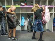 Woodland Intermediate School second-graders Branson Davis, from left, Carson Jordan, and Alexis Dalpias on their first day of school this year on Aug. 28.