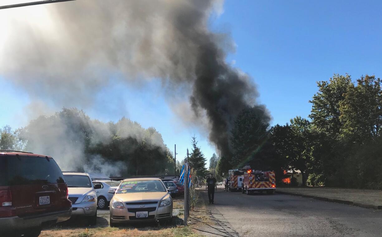 A column of smoke rises from a burning mobile home in Salmon Creek Sunday afternoon. No one was injured.