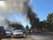 A column of smoke rises from a burning mobile home in Salmon Creek Sunday afternoon. No one was injured.