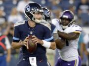 Tennessee Titans quarterback Luke Falk (11) plays against the Minnesota Vikings in the first half of a preseason NFL football game Thursday, Aug. 30, 2018, in Nashville, Tenn.