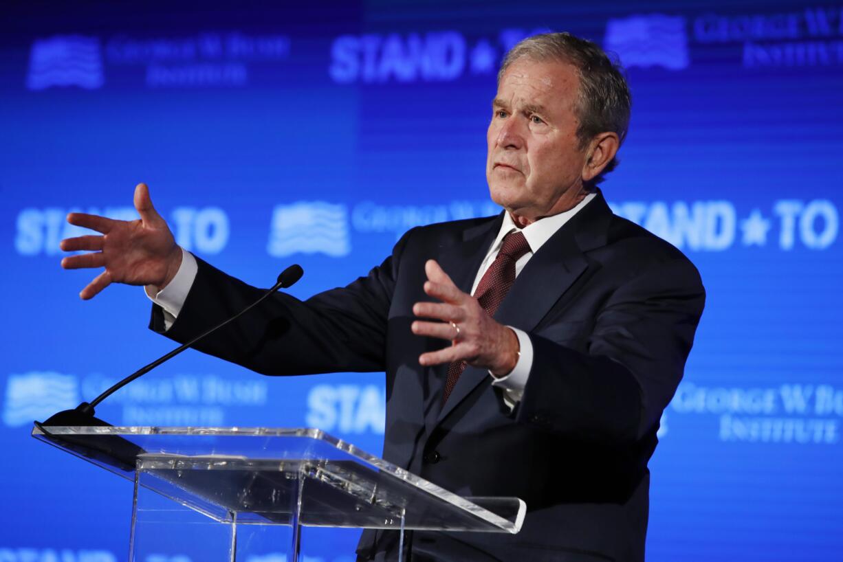 FILE - In this June 23, 2017 file photo, former President George W. Bush speaks during "Stand-To," a summit held by the George W. Bush Institute focused on veteran transition, in Washington. Bush will be in Florida on Friday to fundraise for Gov. Rick Scott's bid to oust Democratic Sen. Bill Nelson in a closely watched and expensive campaign.