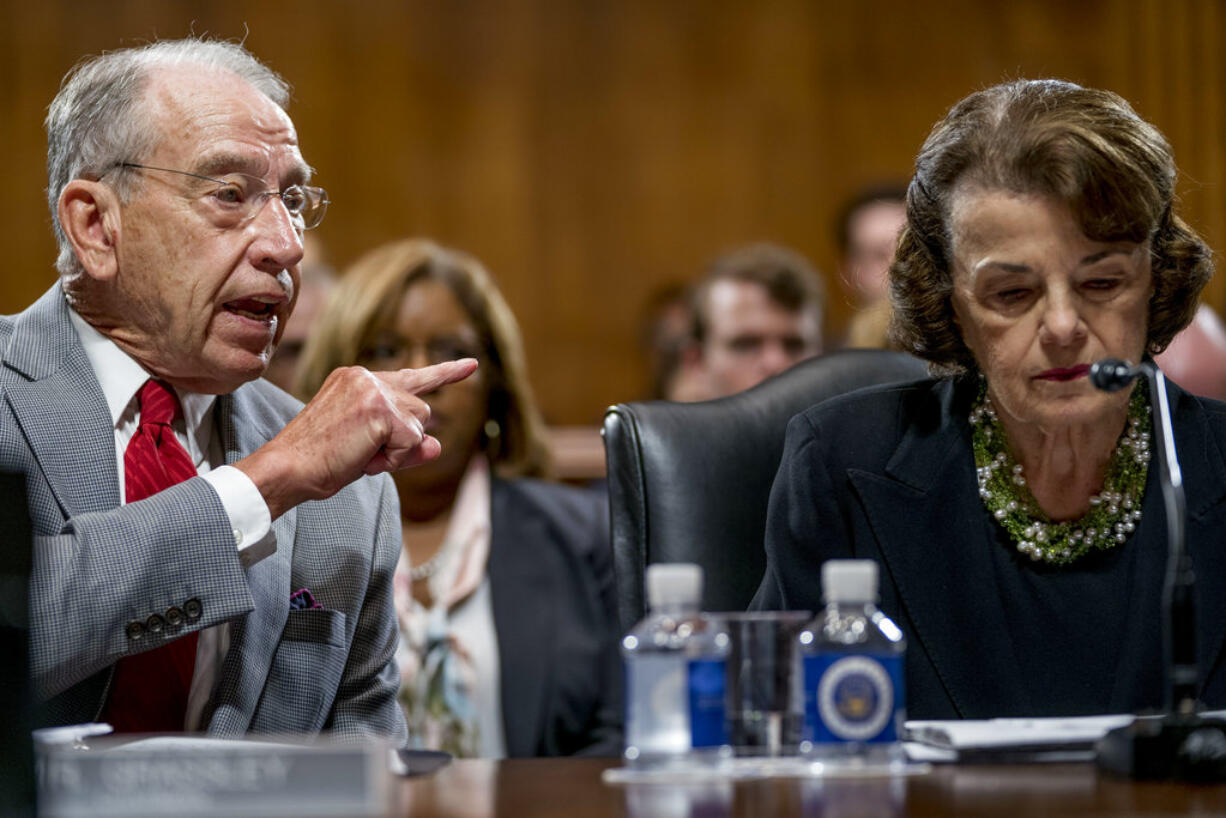 Senate Judiciary Committee Chairman Chuck Grassley, R-Iowa, left, accompanied by Sen. Dianne Feinstein, D-Calif., the ranking member, right, speaks during a Senate Judiciary Committee markup meeting on Capitol Hill, Thursday, Sept. 13, 2018, in Washington. The committee will vote next week on whether to recommend President Donald Trump's Supreme Court nominee, Brett Kavanaugh for confirmation. Republicans hope to confirm him to the court by Oct.