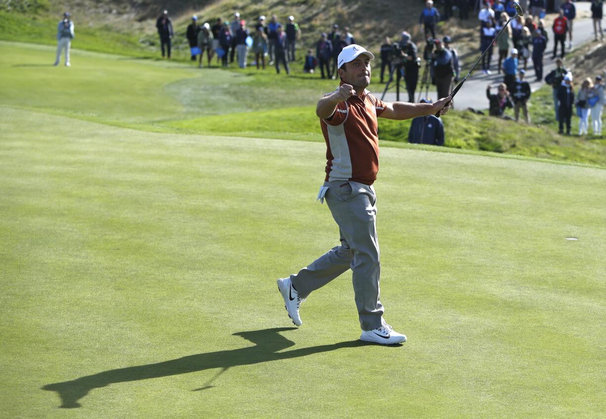 Europe's Francesco Molinari celebrates after winning the 12th hole during a fourball match on the second day of the 42nd Ryder Cup at Le Golf National in Saint-Quentin-en-Yvelines, outside Paris, France, Saturday, Sept. 29, 2018.