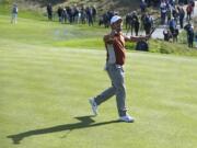 Europe's Francesco Molinari celebrates after winning the 12th hole during a fourball match on the second day of the 42nd Ryder Cup at Le Golf National in Saint-Quentin-en-Yvelines, outside Paris, France, Saturday, Sept. 29, 2018.