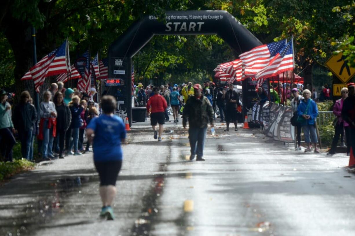Runners are spread thin as they reach the finish line of the inaugural Apple Tree Marathon in Vancouver on Sunday, September 16, 2018.