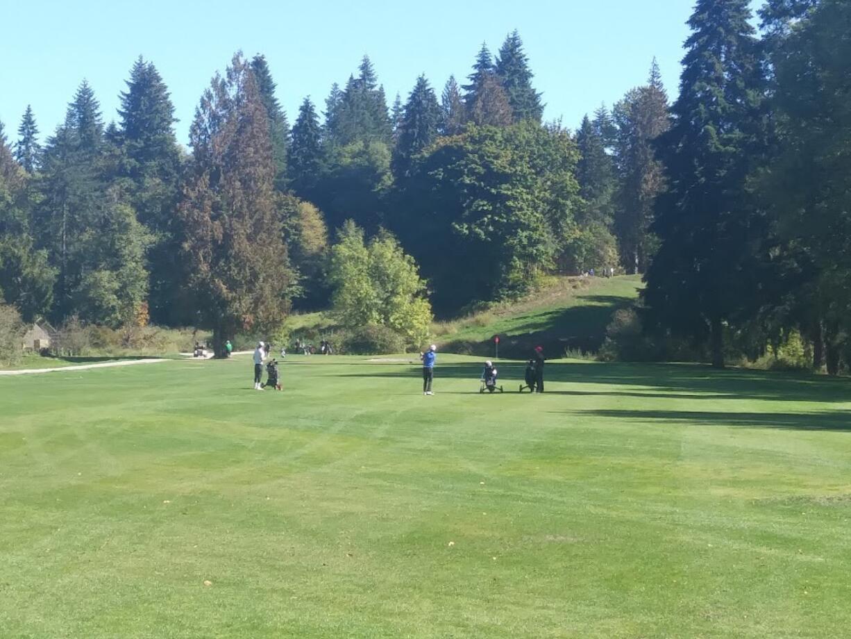 Golfers play the 17th hole at The Cedars on Salmon Creek during Wednesday's Prairie Invitational.