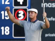 Bryson DeChambeau reacts after putting out on the 18th hole during the final round of the Dell Technologies Championship golf tournament at TPC Boston in Norton, Mass., Monday, Sept. 3, 2018.