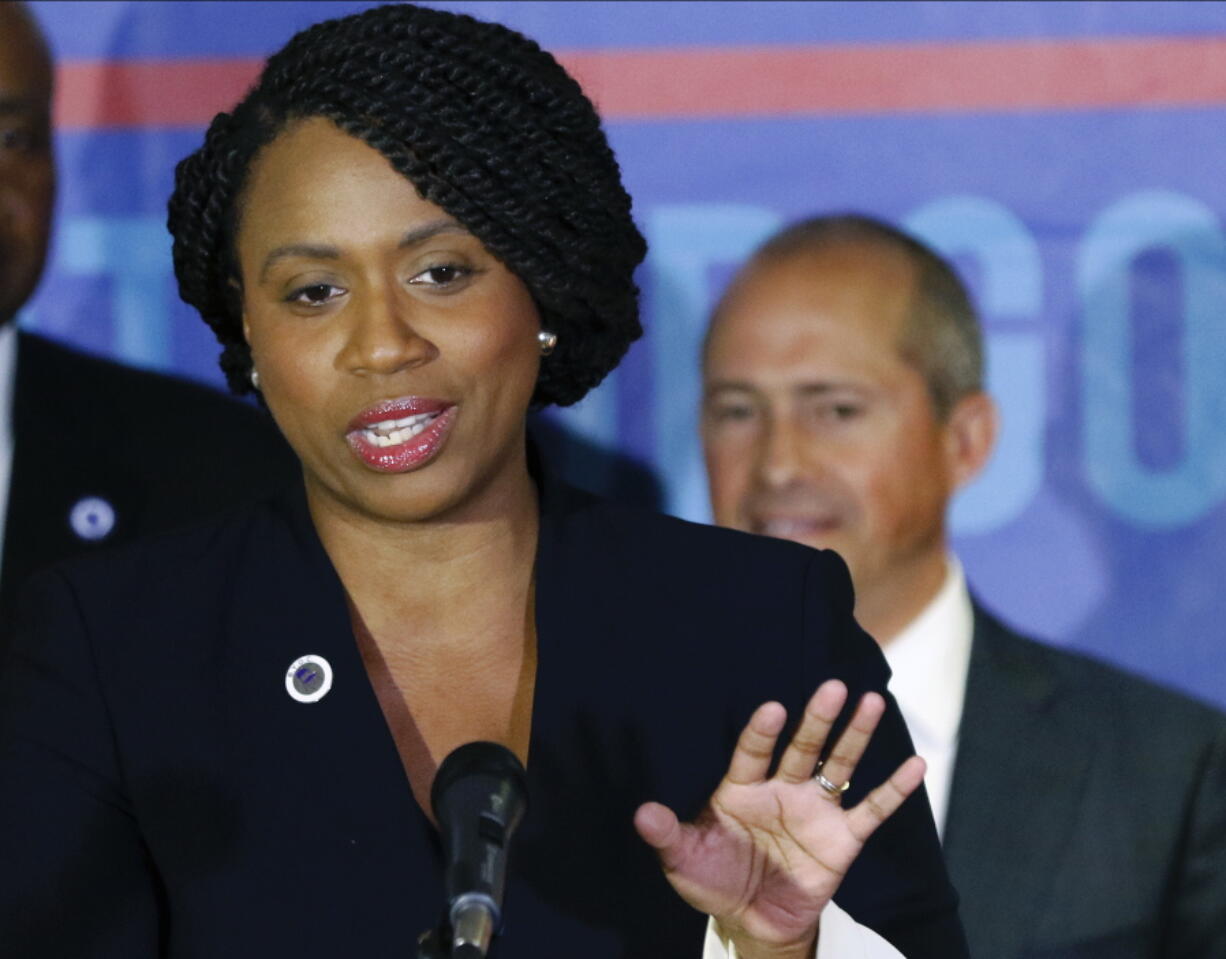 FILE - In this Sept. 5, 2018, file photo, Ayanna Pressle speaks at a Massachusetts Democratic Party unity event in Boston. At right is Jay Gonzalez, winner of the Massachusetts Democratic gubernatorial primary. At the annual meeting of the Congressional Black Caucus Sept. 14, black female candidates who prevailed in primaries over established incumbents said it’s time for a conversation about how the party is structured. “It is not enough to just talk about a blue wave and Democrats being in the majority,” said Pressley. “What matters is who are those Democrats?