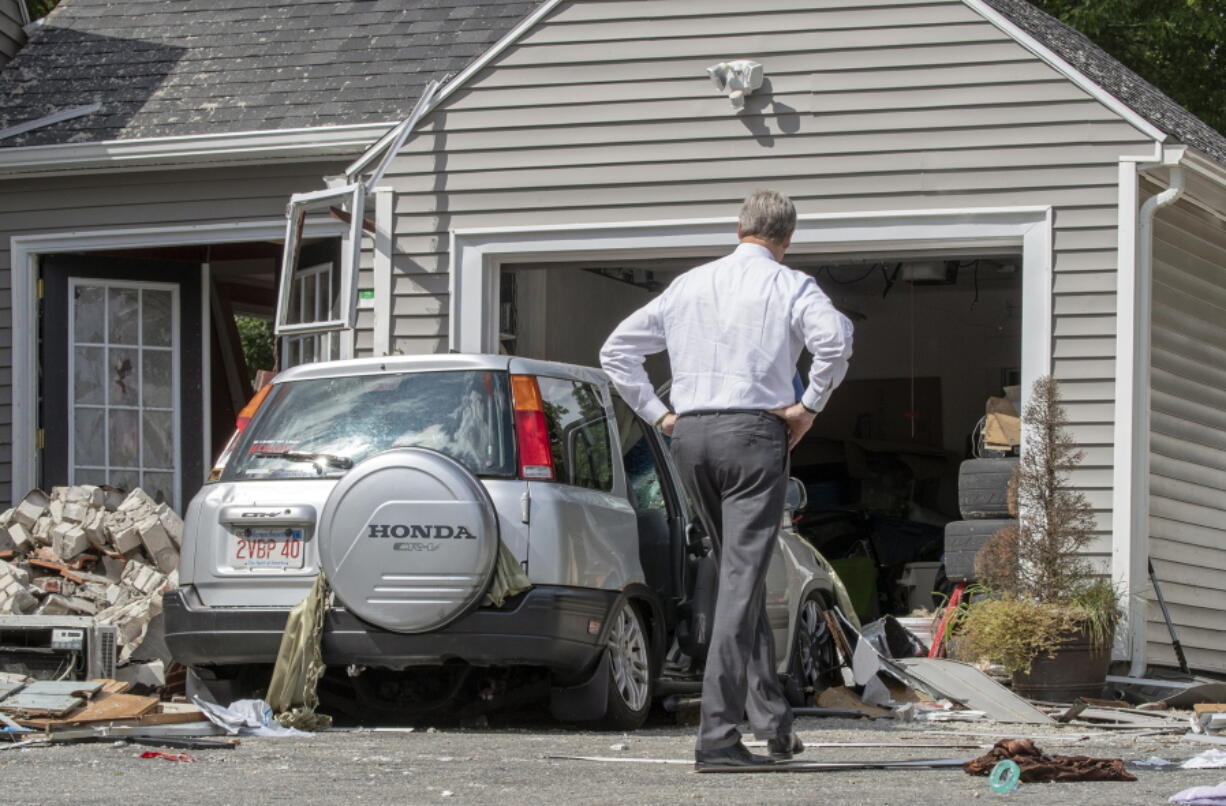 Massachusetts Gov. Charlie Baker tours 35 Chickering St., where a young man was killed during a gas explosion Friday in Lawrence, Mass.