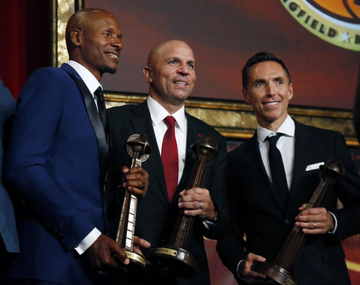 Ray Allen, Jason Kidd and Steve Nash, from left, pose for a photo after induction ceremonies at the Basketball Hall of Fame, Friday, Sept. 7, 2018, in Springfield, Mass.