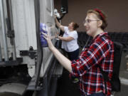 Jade Samples, right, and her mother, Angie Bolster, wash a large truck at a car wash fundraiser for Samples, a Vancouver teen in need of a lifesaving kidney transplant. Samples was diagnosed with Lupus last year, and has encountered a series of medical problems that have delayed her kidney transplant.