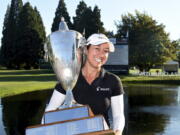 Marina Alex holds the trophy after winning the LPGA Cambia Portland Classic golf tournament in Portland, Ore., Sunday, Sept. 2, 2018.