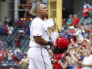 Texas Rangers’ Adrian Beltre walks to the dugout after being relieved of his duties at third base during the sixth inning of a baseball game against the Seattle Mariners, Sunday, Sept. 23, 2018, in Arlington, Texas.