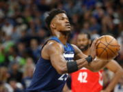 With Jimmy Butler’s trade demand swirling like a dark cloud around Minnesota Timberwolves’ coach Tom Thibodeau, newly minted super-max player Karl-Anthony Towns and the Timberwolves arrive for training camp.