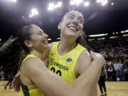 Seattle Storm's Breanna Stewart, right, is embraced by Sue Bird after the Storm defeated the Phoenix Mercury 94-84 during Game 5 of a WNBA basketball playoff semifinal, Tuesday, Sept. 4, 2018, in Seattle. The Storm advanced to the WNBA finals.