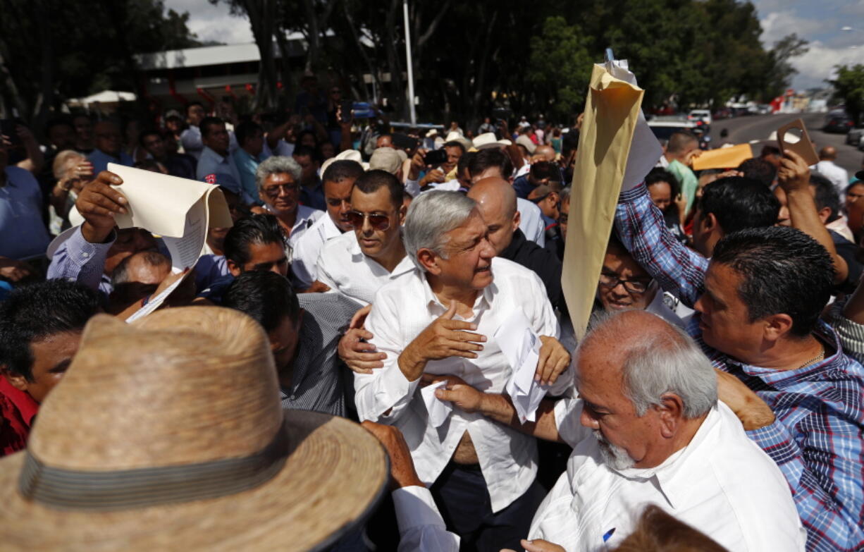 Mexican President-elect Andres Manuel Lopez Obrador walks through supporters as he holds an event Sunday in Tepic, Mexico.