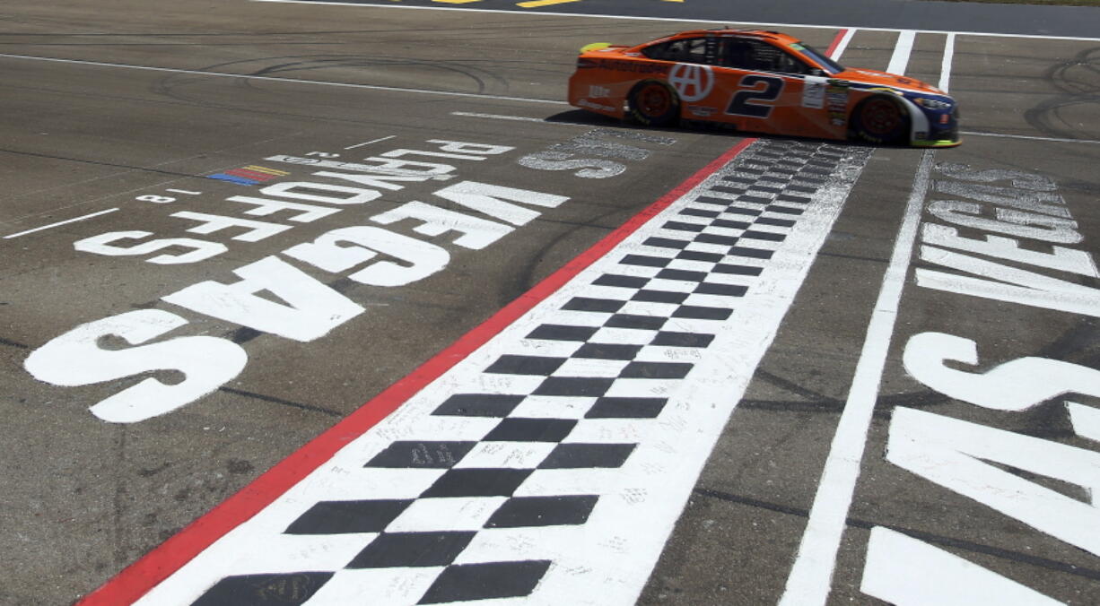 Brad Keselowski drives past the start/finish line during a NASCAR Cup Series auto race Sunday, Sept. 16, 2018, in Las Vegas.