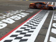 Brad Keselowski drives past the start/finish line during a NASCAR Cup Series auto race Sunday, Sept. 16, 2018, in Las Vegas.