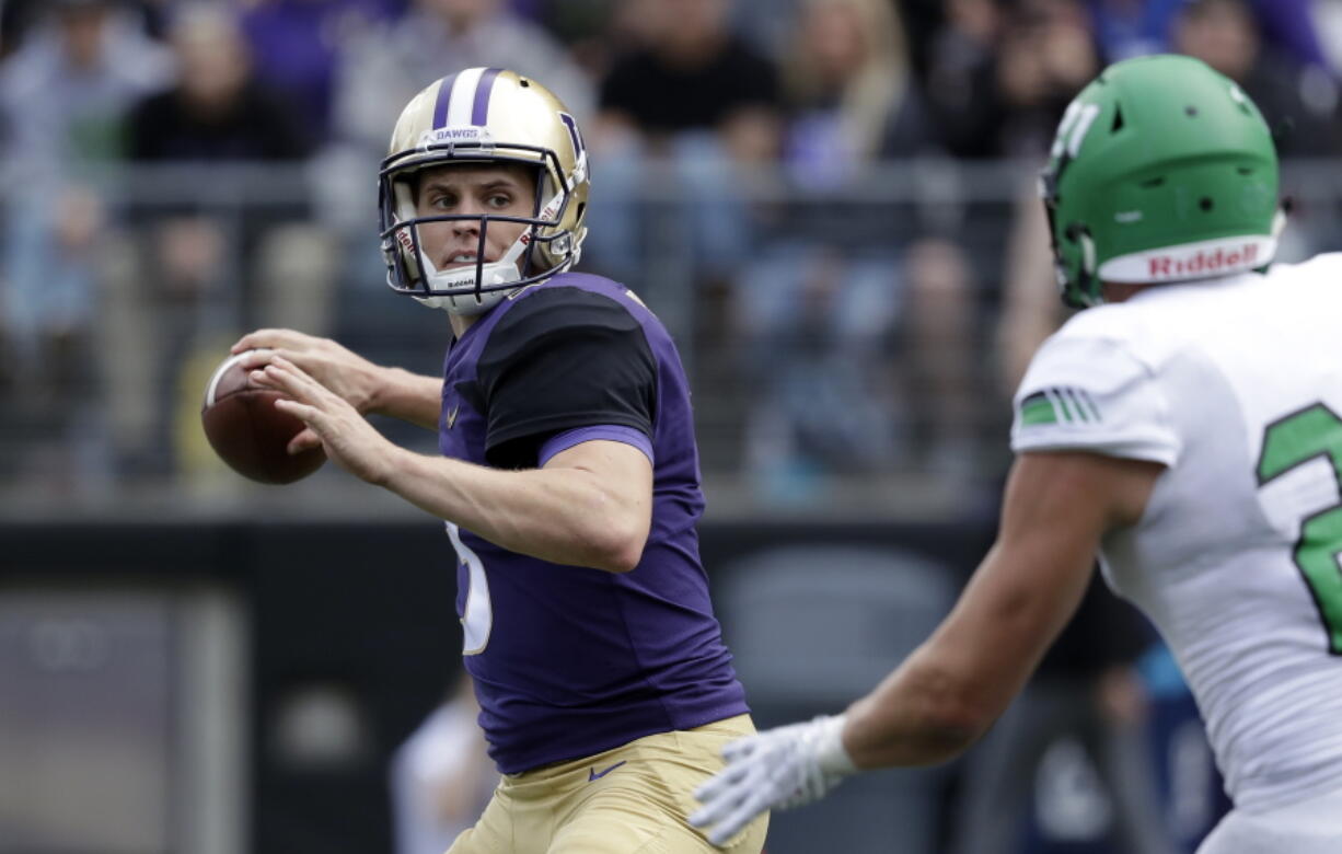 Washington quarterback Jake Browning drops back to pass against North Dakota in the second half of an NCAA college football game Saturday, Sept. 8, 2018, in Seattle.