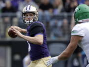 Washington quarterback Jake Browning drops back to pass against North Dakota in the second half of an NCAA college football game Saturday, Sept. 8, 2018, in Seattle.