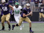 Washington quarterback Jake Browning (3) scrambles against North Dakota in the first half of an NCAA college football game Saturday, Sept. 8, 2018, in Seattle.