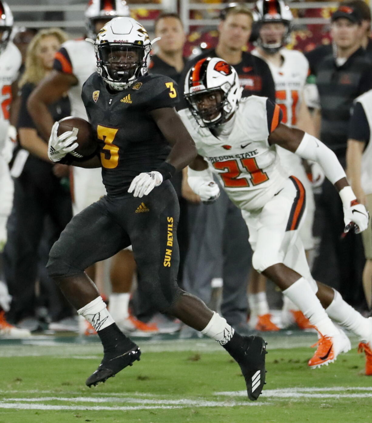 Arizona State running back Eno Benjamin (3) runs as Oregon State cornerback Jaden Robinson (21) pursues during the second half of an NCAA college football game, Saturday, Sept. 29, 2018, in Tempe, Ariz.