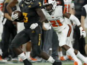 Arizona State running back Eno Benjamin (3) runs as Oregon State cornerback Jaden Robinson (21) pursues during the second half of an NCAA college football game, Saturday, Sept. 29, 2018, in Tempe, Ariz.