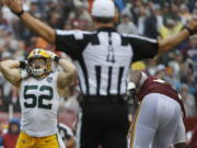 Green Bay Packers linebacker Clay Matthews (52) reacts to his penalty after tackling Washington Redskins quarterback Alex Smith during the second half of an NFL football game, Sunday, Sept. 23, 2018, in Landover, Md.