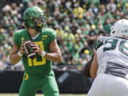 Oregon quarterback Justin Herbert (10) looks for a receiver that will catch his touchdown pass against Portland State during an NCAA college football game in Eugene, Ore., Saturday, Sept. 8, 2018.