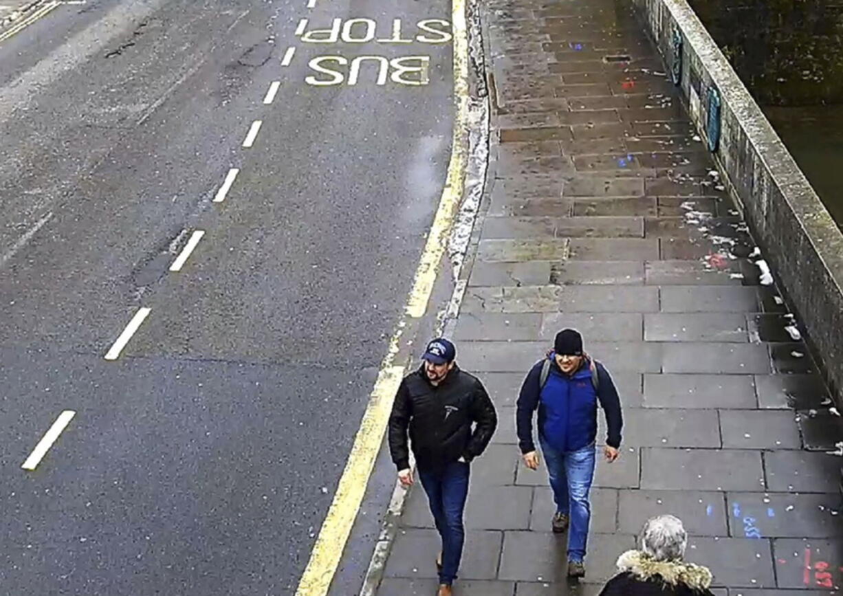 Ruslan Boshirov and Alexander Petrov walk on Fisherton Road, Salisbury, England on March 4, 2018. President Vladimir Putin said on Wednesday, Sept. 12, 2018 that Russia has identified the two men that Britain named as suspects in the poisoning of a former Russian spy, and that there is “nothing criminal” about them.