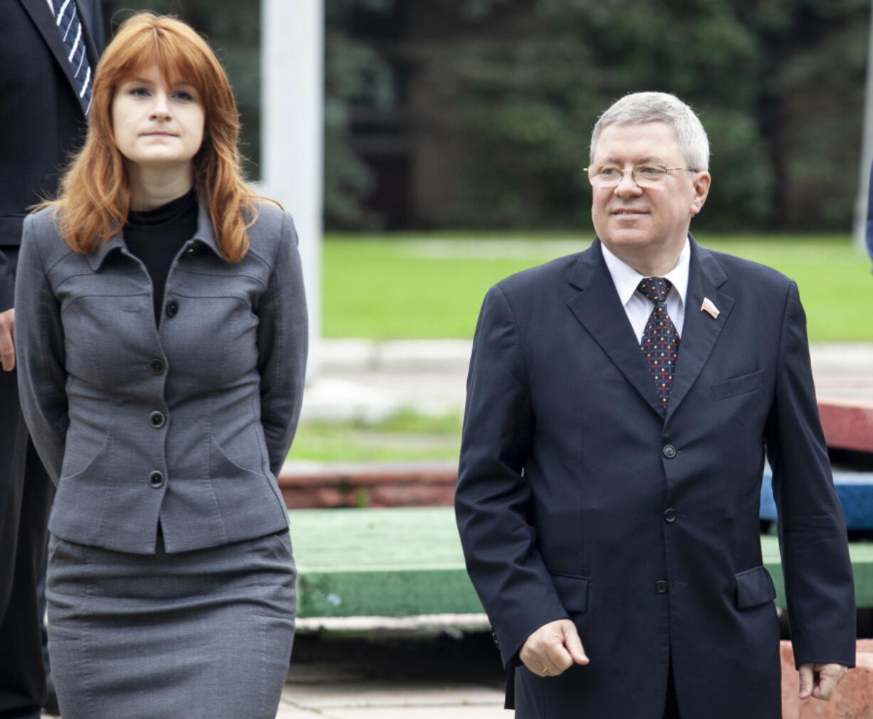 In this photo taken on Friday, Sept. 7, 2012, Maria Butina walks with Alexander Torshin then a member of the Russian upper house of parliament in Moscow, Russia. When gun activist Maria Butina arrived in Washington in 2014 to network with the NRA, she was peddling a Russian gun rights movement that was already dead. Fellow gun enthusiasts and arms industry officials describe the strange trajectory of her Russian gun lobby project, which U.S. prosecutors say was a cover for a Russian influence campaign. Accused of working as a foreign agent, Butina faces a hearing Monday, Sept. 10 in Washington.