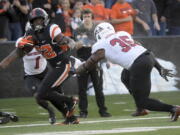 Oregon State’s Jermar Jefferson carries the ball against Southern Utah during an NCAA college football game Saturday, Sept. 8, 2018, in Corvallis, Ore.