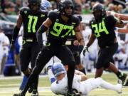 Oregon linebacker Jalen Jelks (97) flexes after sacking San Jose State quarterback Josh Love during the second quarter of an NCAA college football game at Autzen Stadium, Saturday, Sept. 15, 2018, in Eugene, Ore.