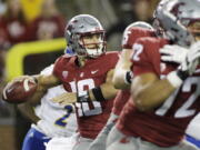 Washington State quarterback Gardner Minshew II, left, looks to pass during the first half of an NCAA college football game against San Jose State in Pullman, Wash., Saturday, Sept. 8, 2018.