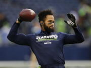 Seahawks safety Earl Thomas ended his holdout without a new deal Wednesday, but it’s unclear if he’ll play Sunday.