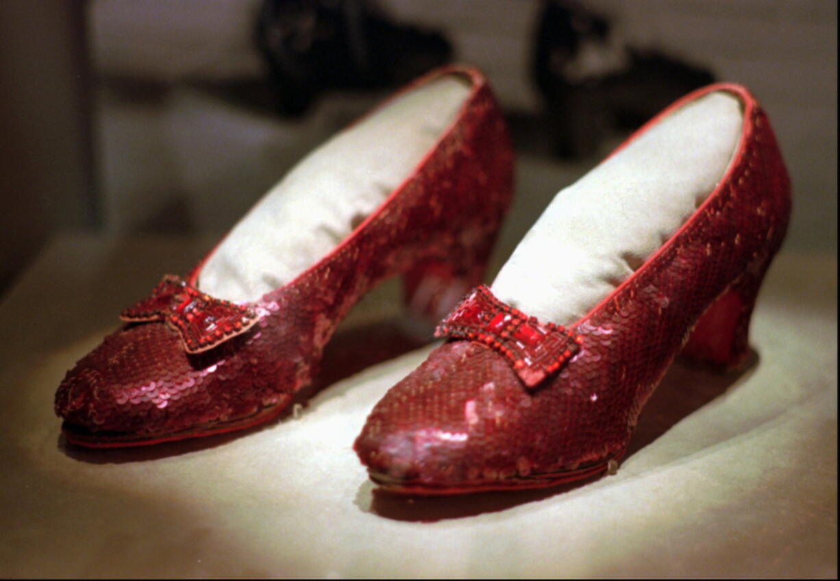 FILE - This April 10, 1996, file photo shows one of the four pairs of ruby slippers worn by Judy Garland in the 1939 film “The Wizard of Oz” on display during a media tour of the “America’s Smithsonian” traveling exhibition in Kansas City, Mo. Federal authorities say they have recovered a pair of ruby slippers worn by Garland that were stolen from the Judy Garland Museum in Grand Rapids, Minn., in August 2005 when someone went through a window and broke into the small display case. The shoes were insured for $1 million.