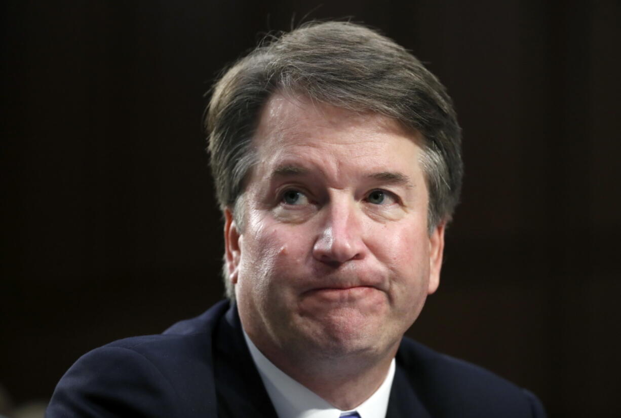 Supreme Court nominee Brett Kavanaugh reacts as he testifies after questioning before the Senate Judiciary Committee on Capitol Hill in Washington. Official Washington is scrambling Monday to assess and manage Kavanaugh’s prospects after his accuser, Christine Blasey Ford, revealed her identity to The Washington Post and described an encounter she believes was attempted rape. Kavanaugh reported to the White House amid the upheaval, but there was no immediate word on why or whether he had been summoned.