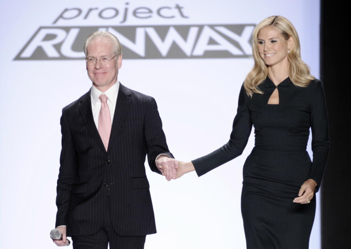 FILE - In this Sept. 12, 2008 file photo, Project Runway’s Tim Gunn walks with Heidi Klum on the runway during Fashion Week in New York. Klum and Gunn are leaving ‘ÄúProject Runway.’Äù Amazon Prime Video on Friday announced the supermodel and fashion consultant are helping to develop a new reality fashion series, which will combine content with commerce.