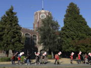 Striking Tacoma Public Schools teachers walk a picket line Thursday in front of Lincoln High School in Tacoma. (Ted S.