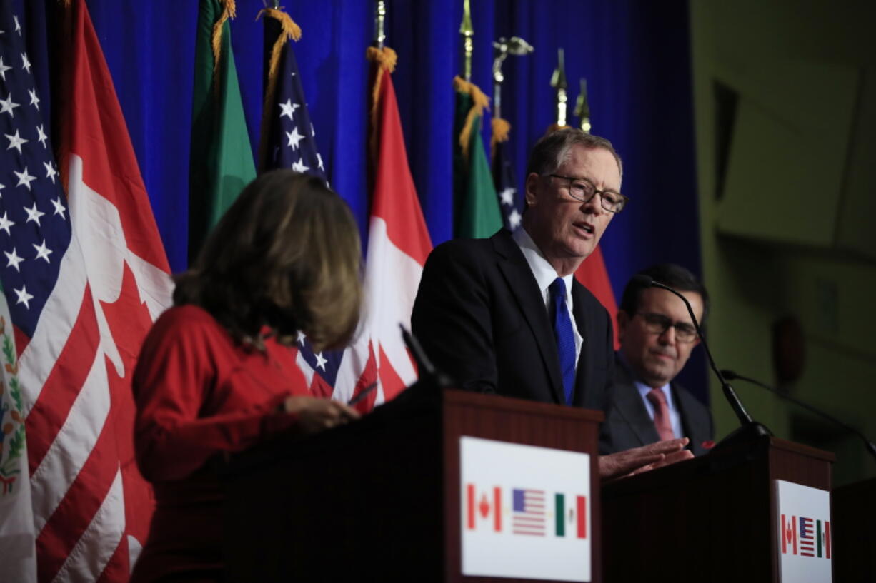 FILE- In this Oct. 17, 2017, file photo, U.S. Trade Representative Robert Lighthizer, center, with Canadian Minister of Foreign Affairs Chrystia Freeland, left, and Mexico’s Secretary of Economy Ildefonso Guajardo Villarreal, right, speaks during the conclusion of the fourth round of negotiations for a new North American Free Trade Agreement (NAFTA) in Washington. U.S. and Canadian negotiators are working long hours to keep Canada in a North American trade bloc. Freeland resumed talks Wednesday, Sept. 19, 2018, with Lighthizer.