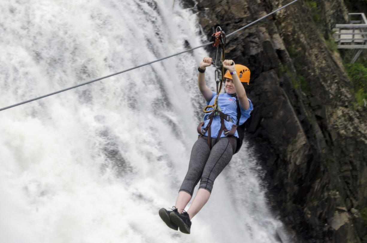 Lily Henry-Austin, 15, of Silver Spring, Md., soars across the expanse June 28 in front of Montmorency Falls on the outskirts of Quebec City. Higher than Niagara Falls, Montmorency Falls is a big draw for visitors to Quebec City and a compelling reason to venture beyond the walls of Old Quebec.