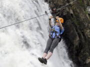 Lily Henry-Austin, 15, of Silver Spring, Md., soars across the expanse June 28 in front of Montmorency Falls on the outskirts of Quebec City. Higher than Niagara Falls, Montmorency Falls is a big draw for visitors to Quebec City and a compelling reason to venture beyond the walls of Old Quebec.