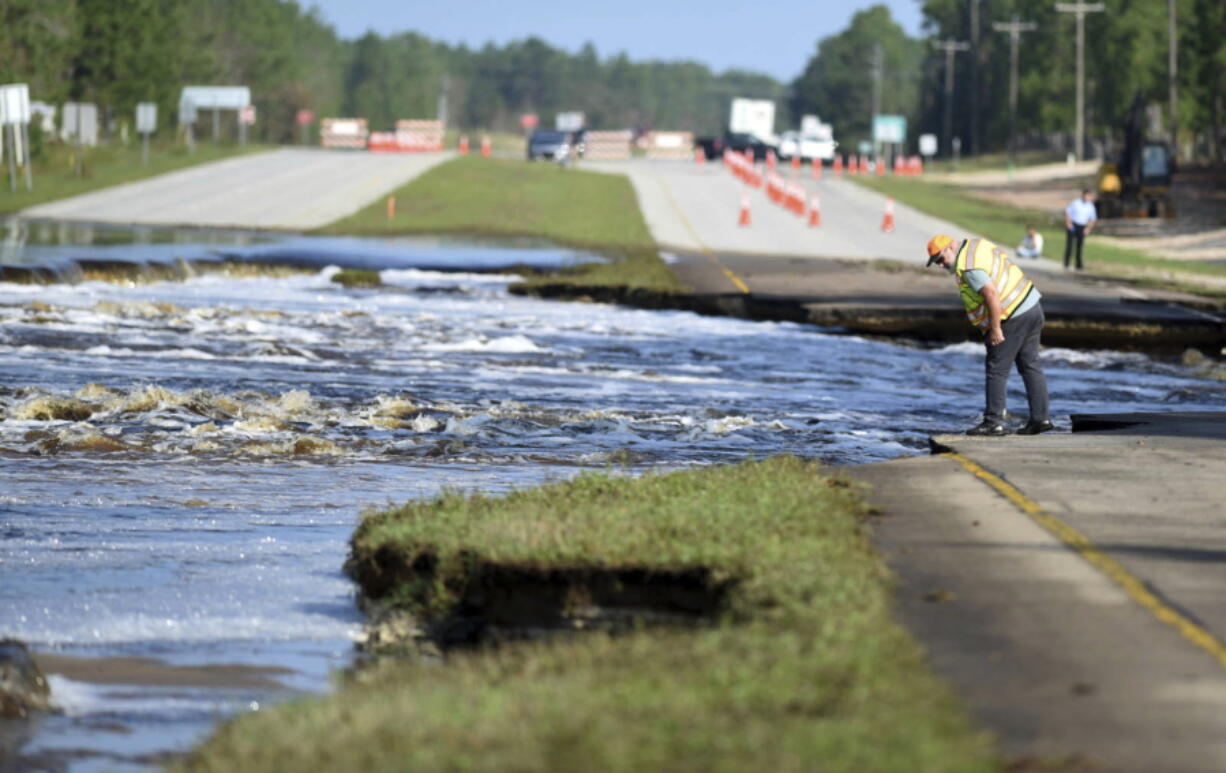 Flooding from Sutton Lake has washed away part of U.S. 421 in New Hanover County just south of the Pender County line in Wilmington, N.C., Friday, Sept. 21, 2018.