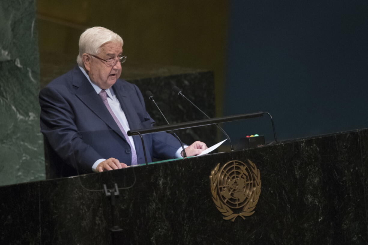 CORRECTS NAME OF SYRIAN DEPUTY PRIME MINISTER TO WALID AL-MOALLEM - Syrian Deputy Prime Minister Walid al-Moallem addresses the 73rd session of the United Nations General Assembly, Saturday, Sept. 29, 2018 at U.N. headquarters.